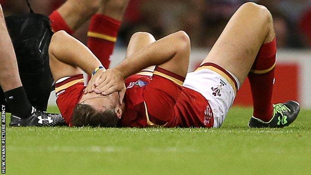 Cory Allen lies down injured