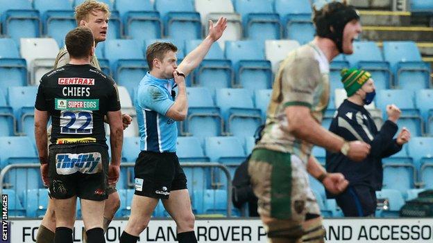 Referee Christophe Ridley ends the game after Joe Simmonds' kick is charged down