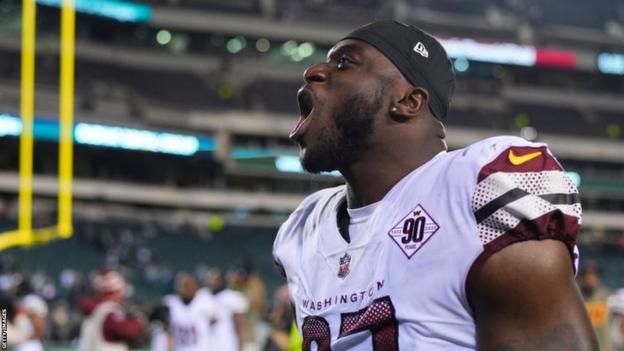 Efe Obada celebrates after the Washington Commanders beat the Philadelphia Eagles in November 2022