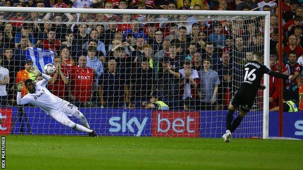 Nottingham Forest goalkeeper Brice Samba saves a penalty kick from Oliver Norwood