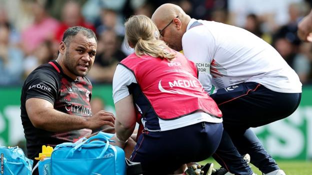 Billy Vunipola receives treatment during Saracens' game at La Rochelle