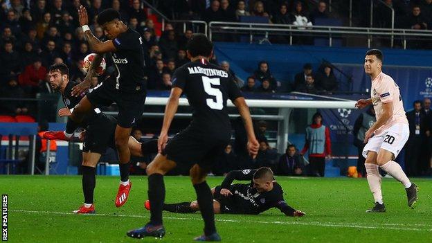 Paris St-Germain's Presnel Kimpembe blocks Diogo Dalot's late shot with his arm, before Manchester United were awarded a penalty via VAR