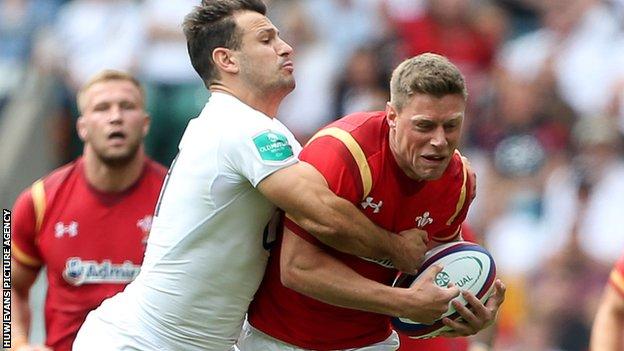 Replacement Rhys Priestland is tackled by Danny Care