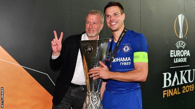 Chelsea owner Roman Abramovich and defender Cesar Azpilicueta celebrate with the Europa League Trophy