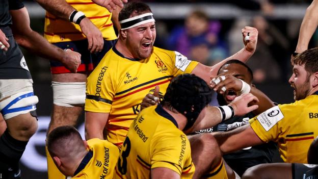Rob Herring celebrates as Nick Timoney crashes over for Ulster's fourth try