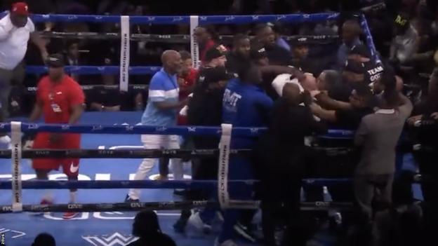 A mass brawl breaks out during the fight between Floyd Mayweather and John Gotti III