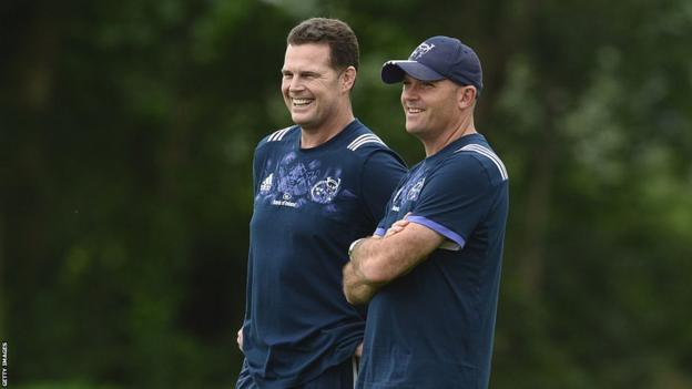 Rassie Erasmus and Jacques Nienaber wearing bluish  Munster grooming  kit