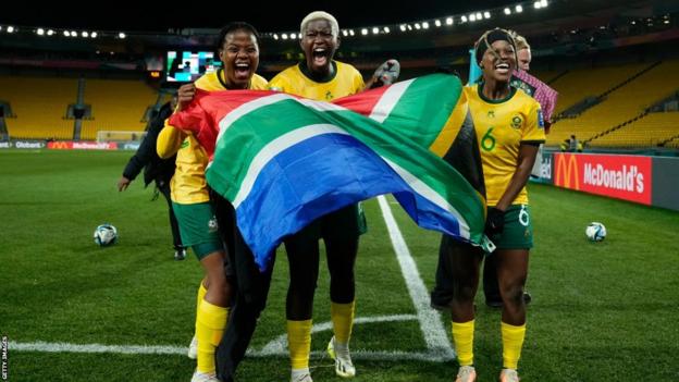 South Africa players celebrate reaching the World Cup knockout phase