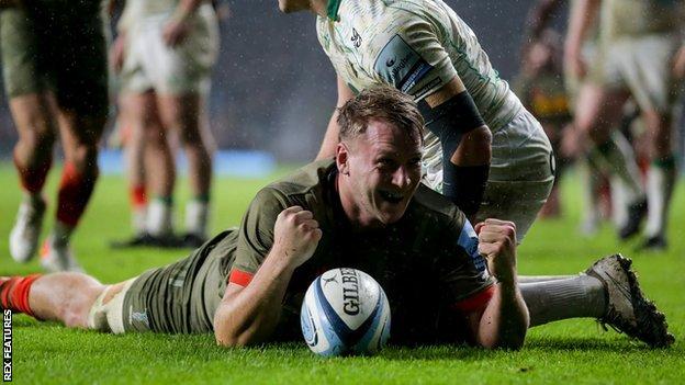 Alex Dombrandt celebrates scoring a try against Northampton Saints