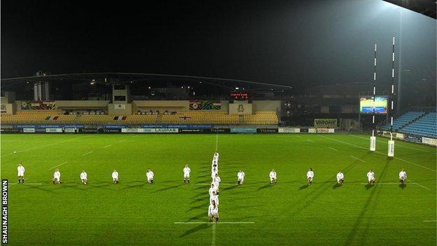 England players standing in the shape of a cross on the pitch