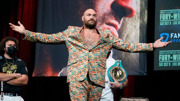 Tyson Fury holds out his arms