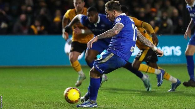 Eastleigh's Chris Maguire scores from penalty