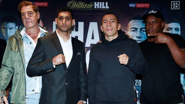 Khan will be fighting under trainer Joe Goossen (left) for the second time