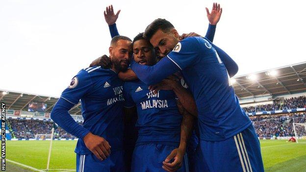 Kadeem Harris is mobbed by team-mates after scoring Cardiff City's fourth goal