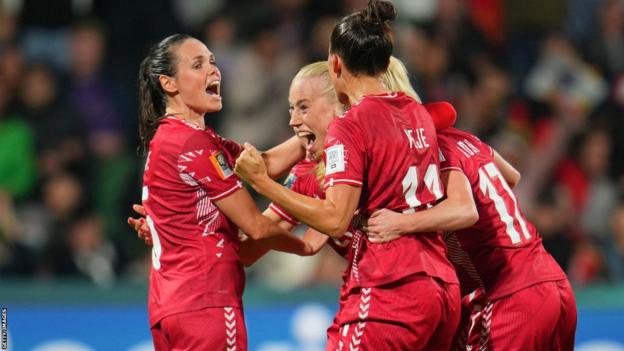 Denmark players celebrate scoring