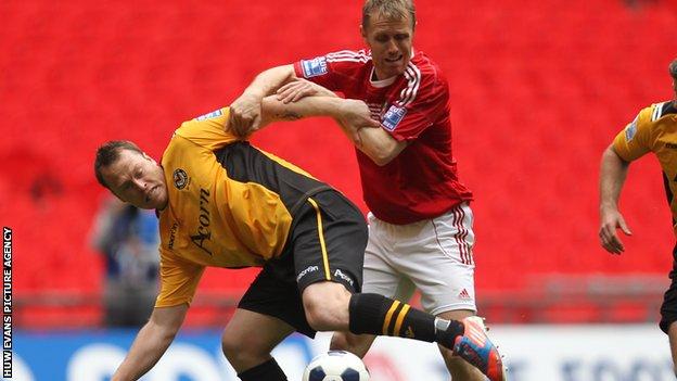 Newport's Mike Flynn battles with Brett Ormerod of Wrexham