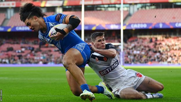 Jack Welsby tackles Samoa's Tim Lafai in the Rugby League World Cup semi-final