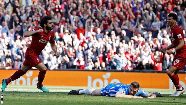 Mohamed Salah (left) celebrates scoring