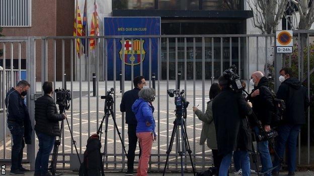 Reporters gathered outside Barcelona's club offices during a raid by regional police