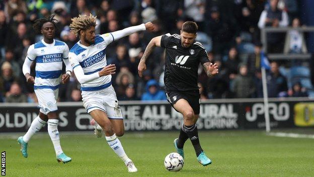 Fulham's Aleksandar Mitrovic and Queens Park Rangers' Jimmy Dunne battle for the ball