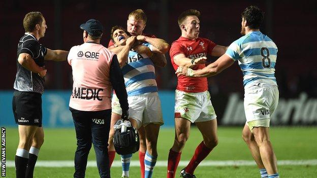 Ross Moriarty and Josh Adams of Wales clash with Nicolas Sanchez and Javier Ortega Desio of Argentina