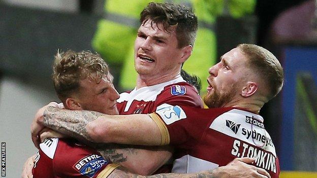 Sam Tomkins (right) celebrates with double try-scorer Dom Manfredi (left) during Wigan's 12-4 Grand Final win over Warrington Wolves