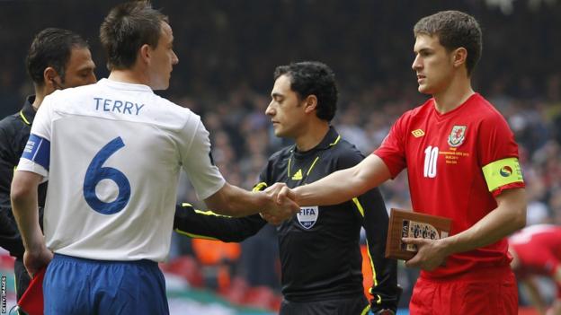 Aaron Ramsey as Wales captain shaking hands with England captain John Terry