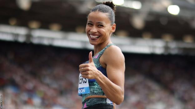 Jazmin Sawyers gives a thumbs up   to the camera astatine  the London Diamond League