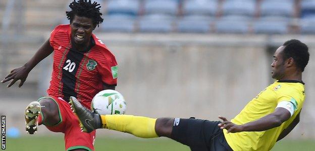 Yamikani Chester of Malawi (left) and Zainadine Junior of Mozambique challenge for the ball