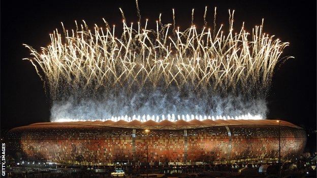 Soccer City stadium in Johannesburg lit up with fireworks