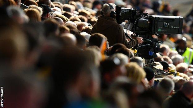 TV camera among the crowd