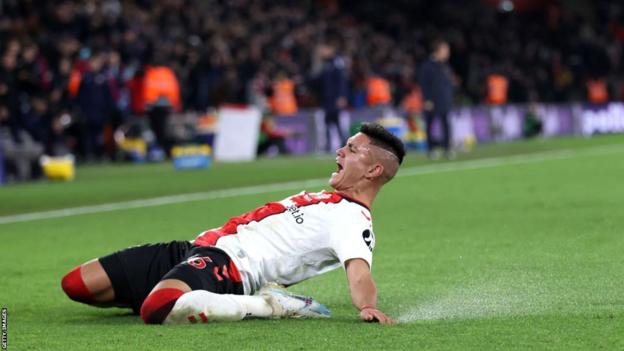 Carlos Alcaraz slides on his knees to celebrate winning goal against Leicester