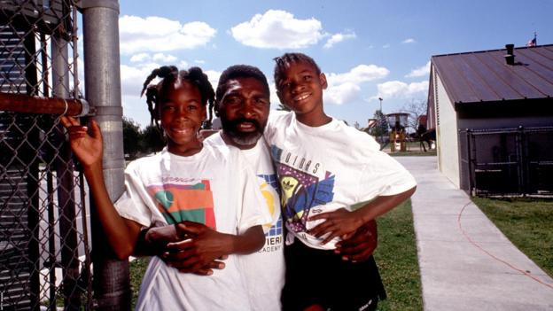 Richard Williams, centre, with his daughters Venus, left, and Serena in 1991