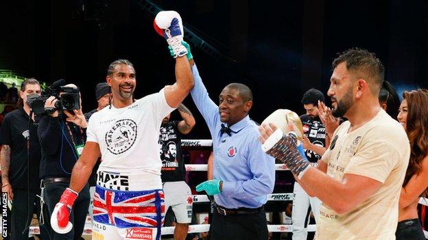 David Haye raises his arm after defeating Joe Fournier during Evander Holyfield vs. Vitor Belfort presented by Triller at Seminole Hard Rock Hotel & Casino on September 11, 2021 in Hollywood, Florida.