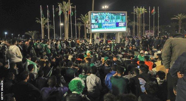 Fans watch the Al Ahli Tripoli vs Al Ittihad Caf Confederation Cup game in Martyrs Square, Tripoli