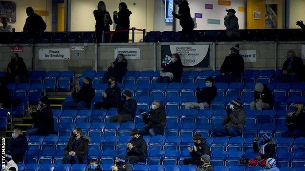 Wycombe fans watching their side's game against Stoke