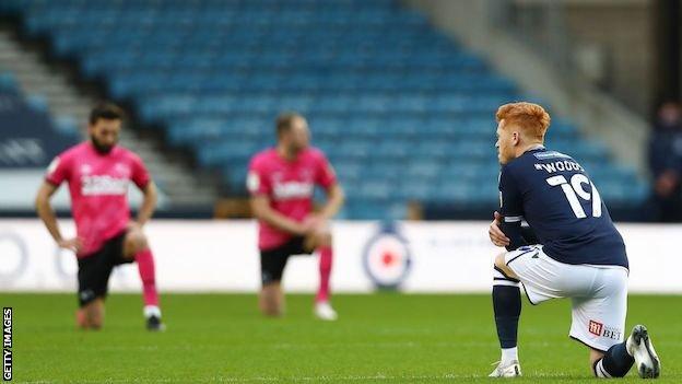 Close up of the Kick It Out sponsor on the Millwall shirt during