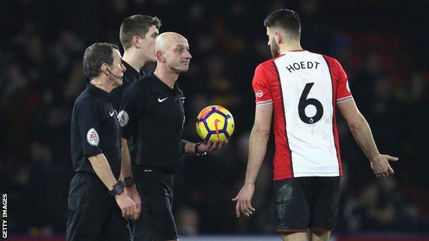Southampton's Wesley Hoedt with referee Roger East after the game