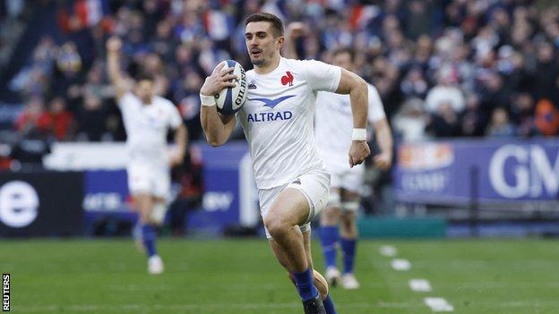 France's Thomas Ramos runs in to score their third try