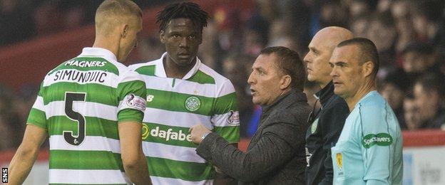 Celtic managers Brendan Rodgers (second right) with defenders Jozo Simunovic and Dedryck Boyata