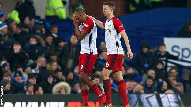 Salomon Rondon is consoled by team-mate Jonny Evans after seeing James McCarthy's injury
