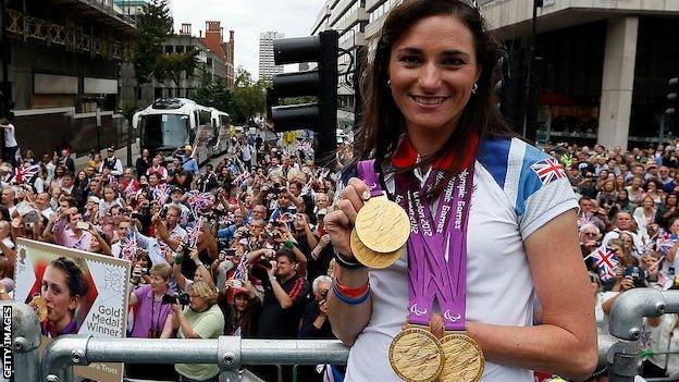 Sarah Storey shows off her gold medals at the London 2012 parade