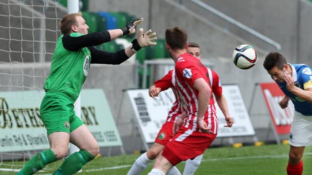 Warrenpoint keeper Aaron Shanahan fails to keep out this header from Linfield striker Andrew Waterworth at Windsor Park