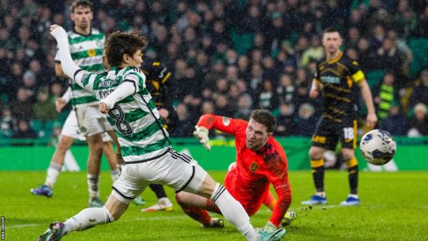 Kyogo Furuhashi touches in the opening goal at Celtic Park