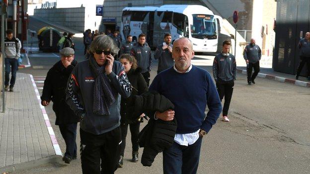 Albacete boss Enrique Martin (left, front) is pictured arriving at the hospital where Pelayo Novo is being treated