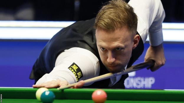 Judd Trump at the table