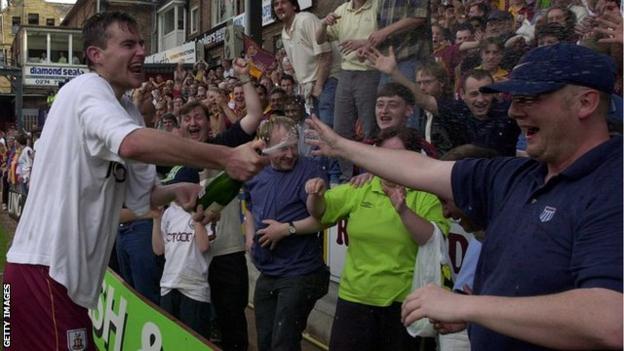 David Wetherall celebrates with fans after Bradford City beat Liverpool in 2000
