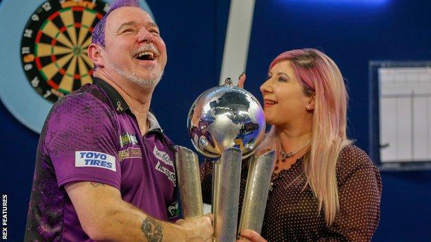Peter and Jo Wright with the PDC World Championship trophy