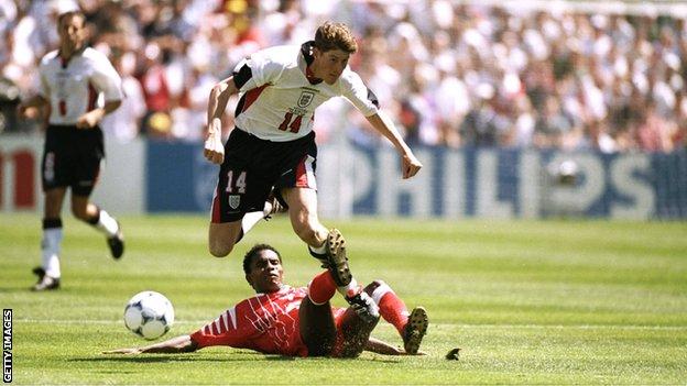 Tunisia's Jose Clayton tackles England's Darren Anderton at the 1998 World Cup