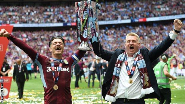Smith (right) celebrates with Jack Grealish after winning promotion to the Premier League via the play-offs